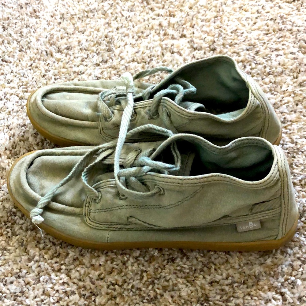 Army green Sanuk shoes.